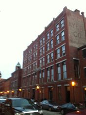 The building which once housed the J.C. Ayer Co. still stands on Lowell's Market Street. On the building's Central Street side, the company's painted advertisement is still visible (Photo by Author. Oct. 2011)