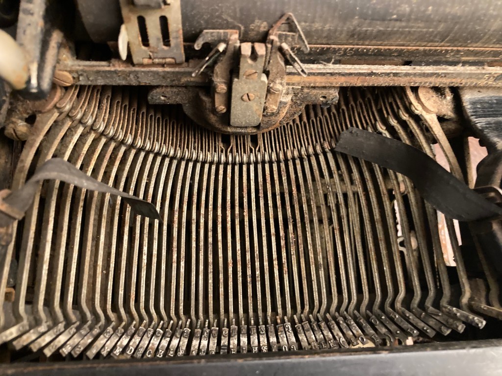 rusted typebars on an LC Smith typewriter